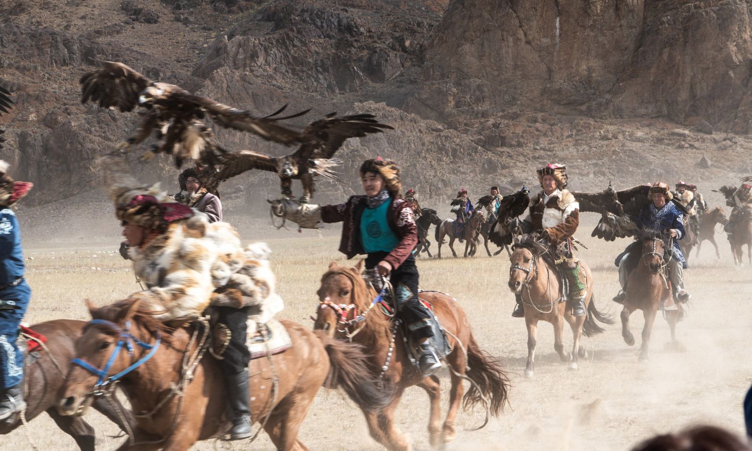 Golden eagles swooping onto the gloves of galloping Kazakh riders at the Golden Eagle Festival